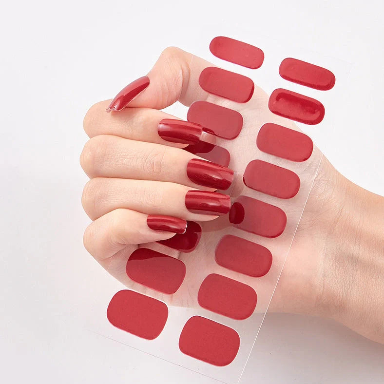 Nail art stickers with alphabet letters in sealed packaging, showing 16 designs per pack