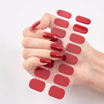 Nail art stickers with alphabet letters in sealed packaging, showing 16 designs per pack