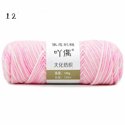 Eight strands of gradient milk cotton wool in a ball, showing multiple colour options for hand knitting.