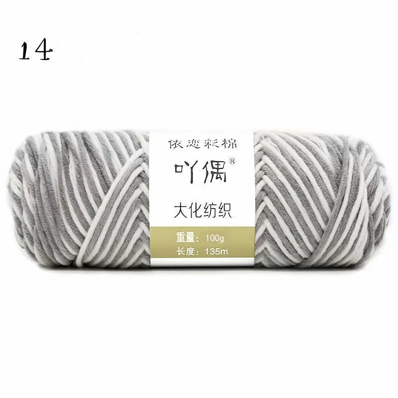 Eight strands of gradient milk cotton wool in a ball, showing multiple colour options for hand knitting.
