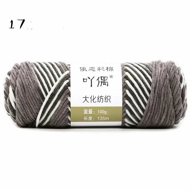 Eight strands of gradient milk cotton wool in a ball, showing multiple colour options for hand knitting.