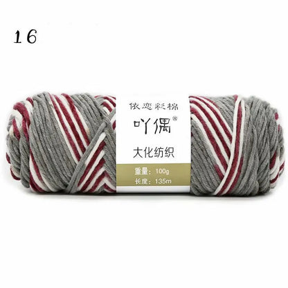 Eight strands of gradient milk cotton wool in a ball, showing multiple colour options for hand knitting.