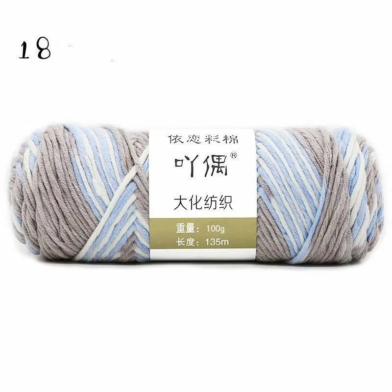 Eight strands of gradient milk cotton wool in a ball, showing multiple colour options for hand knitting.