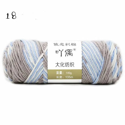 Eight strands of gradient milk cotton wool in a ball, showing multiple colour options for hand knitting.