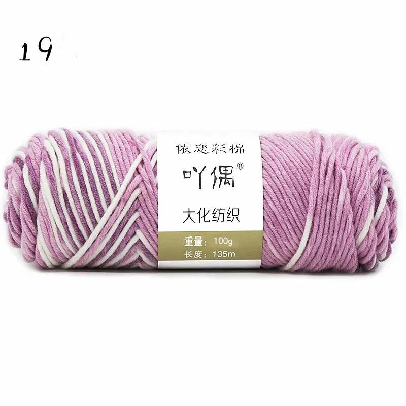 Eight strands of gradient milk cotton wool in a ball, showing multiple colour options for hand knitting.