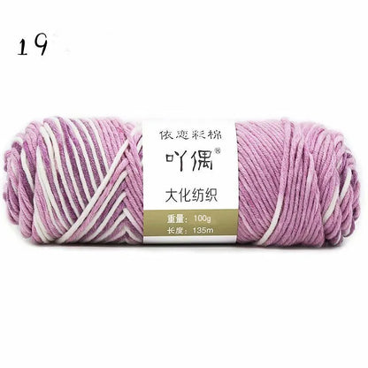 Eight strands of gradient milk cotton wool in a ball, showing multiple colour options for hand knitting.