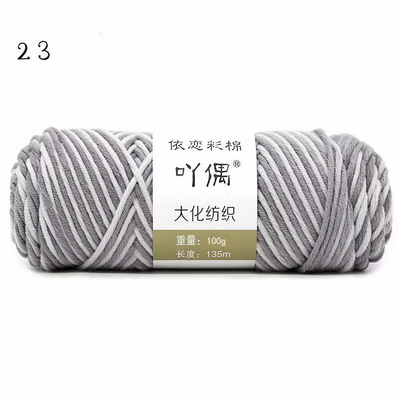 Eight strands of gradient milk cotton wool in a ball, showing multiple colour options for hand knitting.