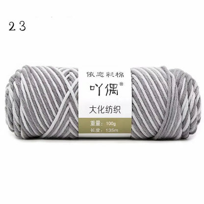 Eight strands of gradient milk cotton wool in a ball, showing multiple colour options for hand knitting.