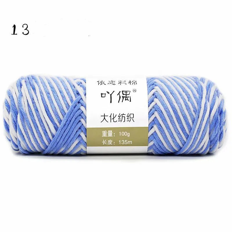 Eight strands of gradient milk cotton wool in a ball, showing multiple colour options for hand knitting.
