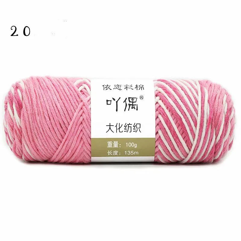 Eight strands of gradient milk cotton wool in a ball, showing multiple colour options for hand knitting.