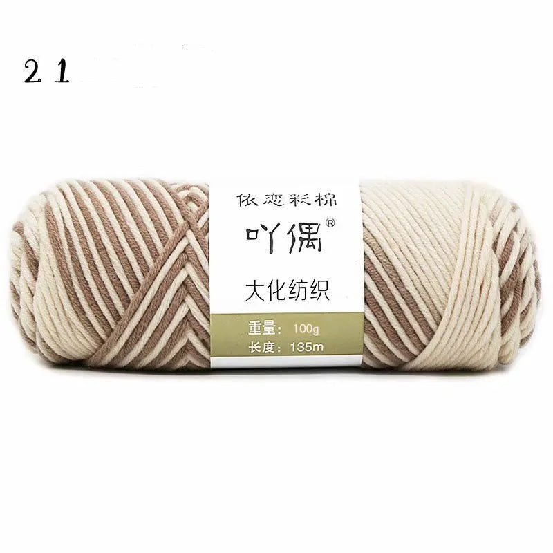 Eight strands of gradient milk cotton wool in a ball, showing multiple colour options for hand knitting.