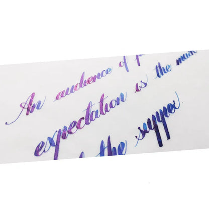 Bottle of MEMORY-0420 sheen gradient fountain pen ink in gold powder colour.