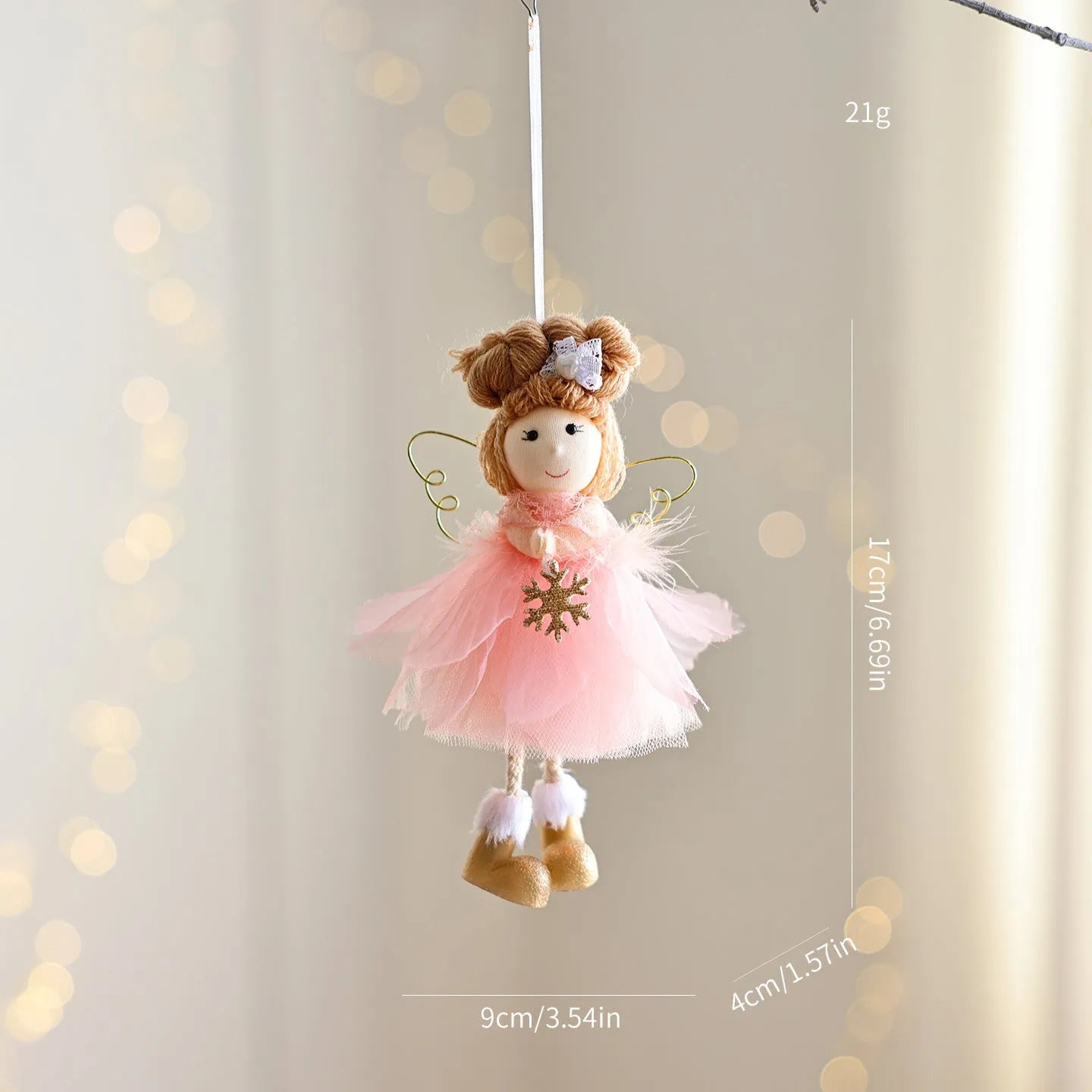 White mesh angel girl Christmas ornament with snowflake detail hanging demonstration