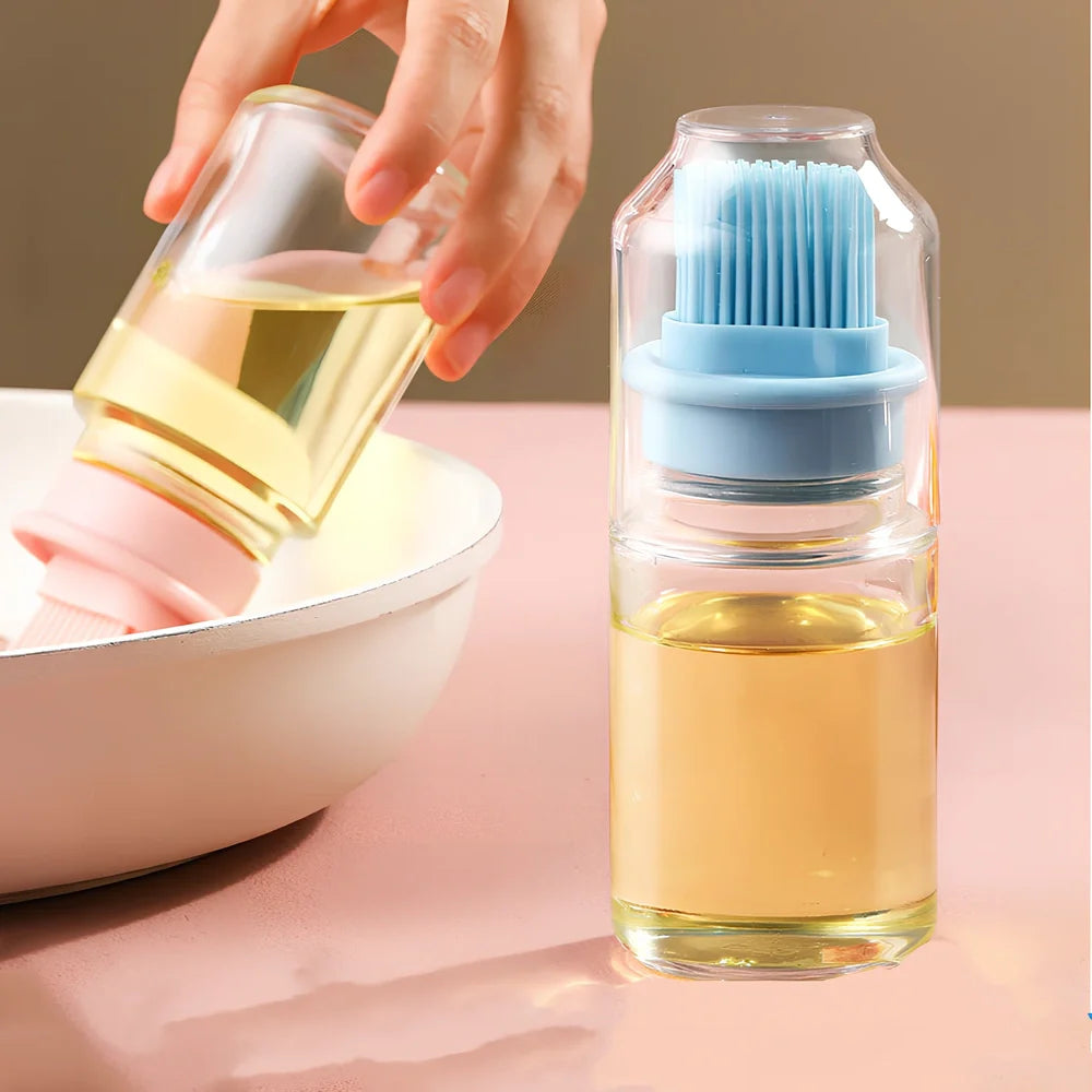 Pink portable oil bottle with silicone brush for baking and barbecue cooking with dust cover