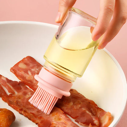 Pink portable oil bottle with silicone brush for baking and barbecue cooking with dust cover