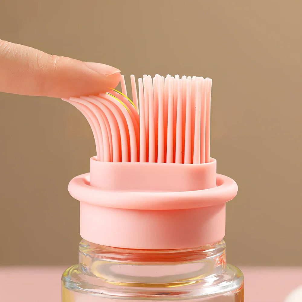 Pink portable oil bottle with silicone brush for baking and barbecue cooking with dust cover