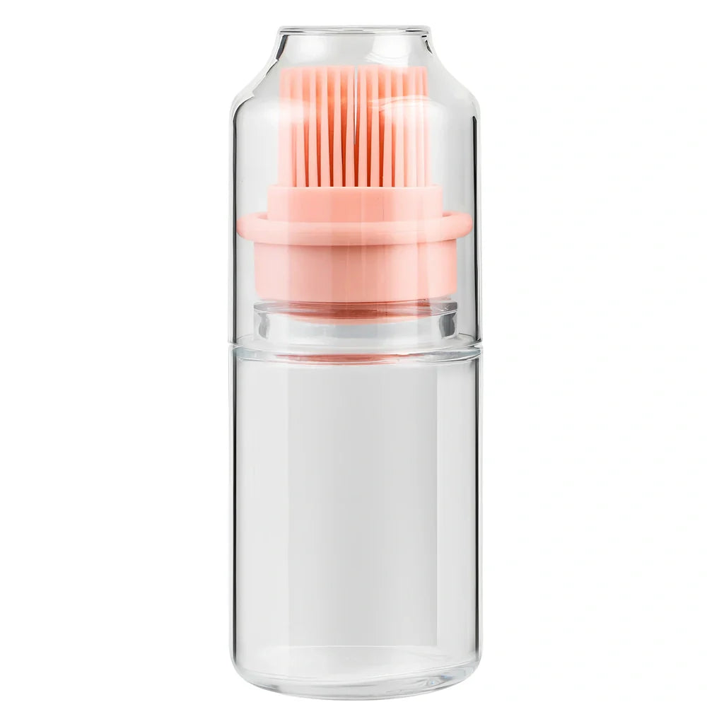 Pink portable oil bottle with silicone brush for baking and barbecue cooking with dust cover
