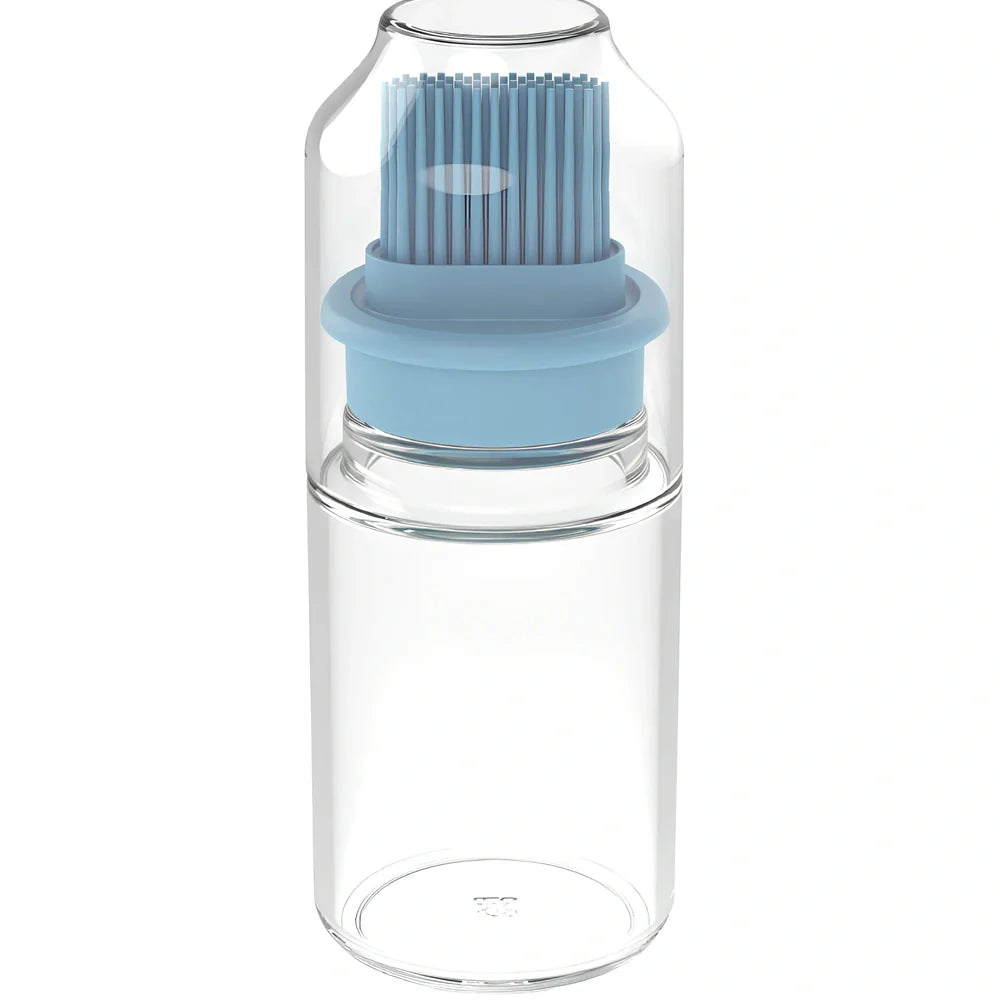 Pink portable oil bottle with silicone brush for baking and barbecue cooking with dust cover