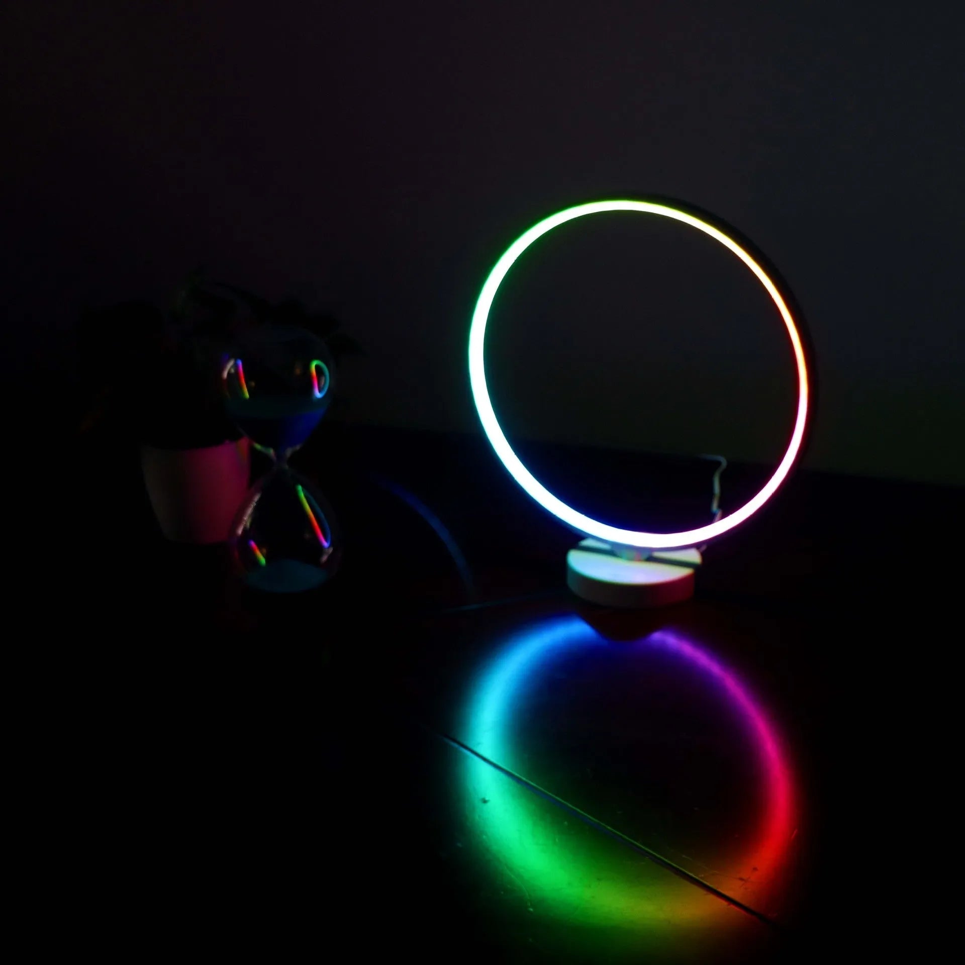 White full moon shaped table lamp with remote control on a table