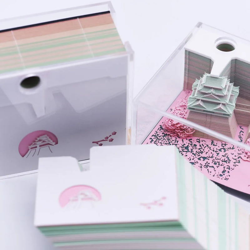 Three-dimensional architectural model Post-it Note featuring Hayao Miyazaki's Spirited Away Tianshou Tower, specialty paper construction in gold, pink or white colour options, detailed 3D building replica display piece for Studio Ghibli fans