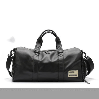 Large black waterproof PU leather sports duffel bag with multiple pockets, shown with a laptop and camera stored in its padded compartments.
