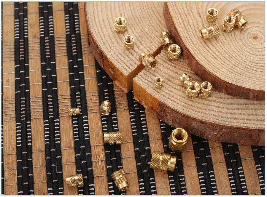 Brass hot melt copper nuts showing M2 and M3 thread sizes with measurement indicators