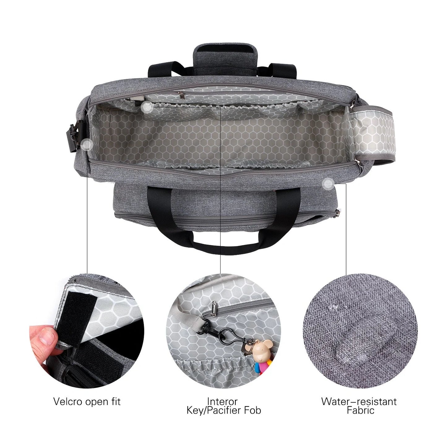 Convertible baby diaper bag in black and grey, transforms into crib and changing table