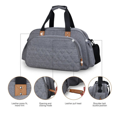 Convertible baby diaper bag in black and grey, transforms into crib and changing table