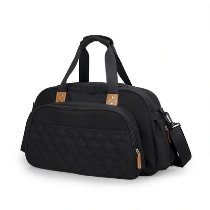 Convertible baby diaper bag in black and grey, transforms into crib and changing table