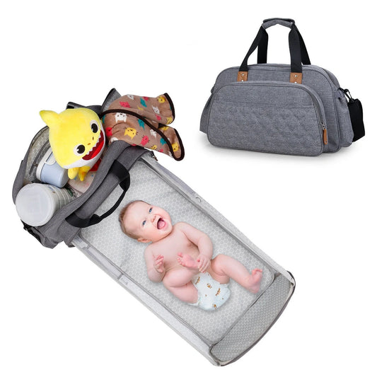 Convertible baby diaper bag in black and grey, transforms into crib and changing table