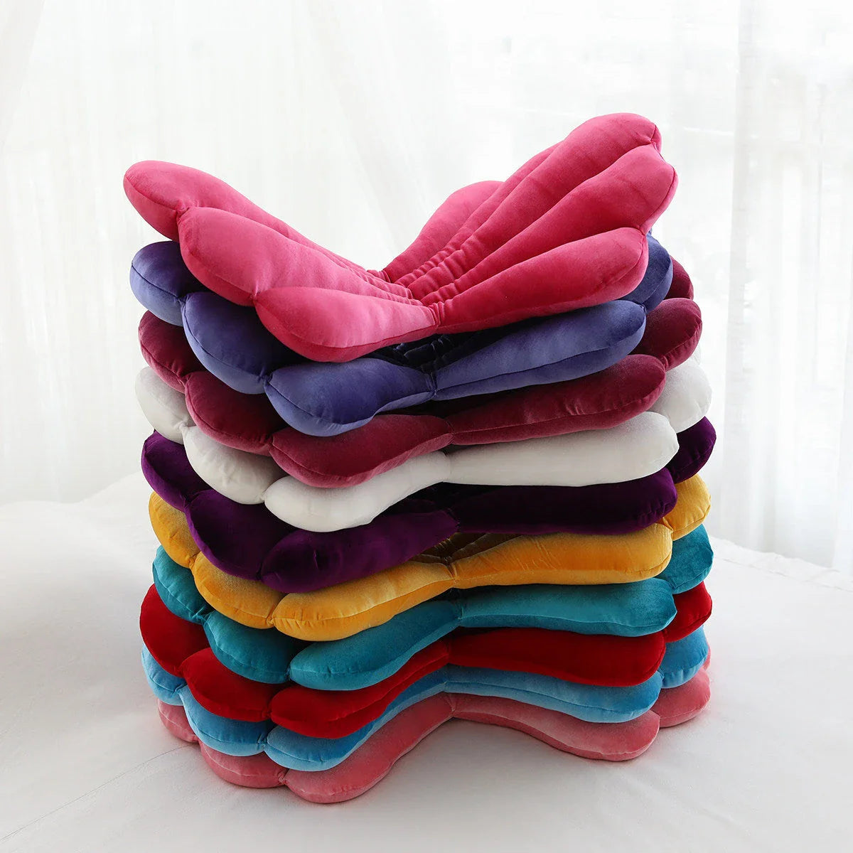 Sumptuous velvet chair cushion with unique rose pattern, available in a range of sophisticated colours