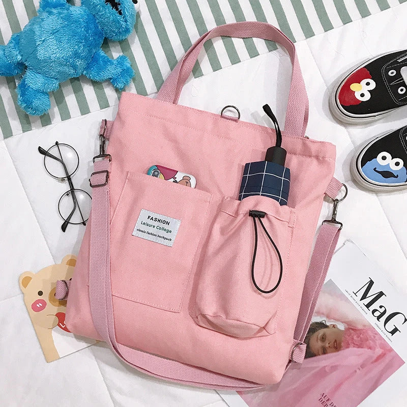 Stylish Harajuku-inspired canvas backpack with pockets, available in a variety of vibrant colors