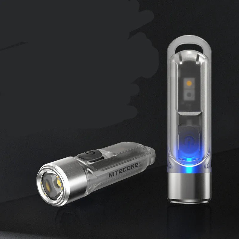 Green Nitecore TIKI mini portable USB rechargeable light with keychain.