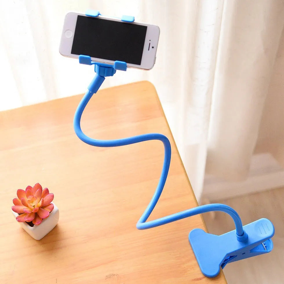 Black flexible long arm phone holder with V-clip gripping a smartphone, bent to position screen for bedside viewing.