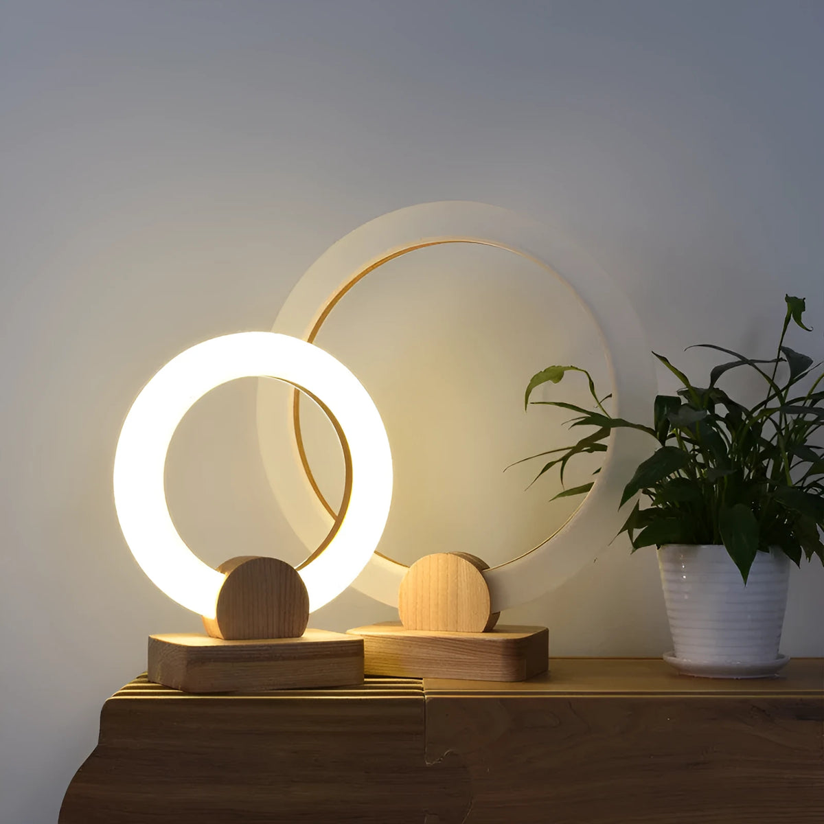 Wooden circular chandelier with white acrylic shade, shown in two diameter sizes for ceiling mounting.