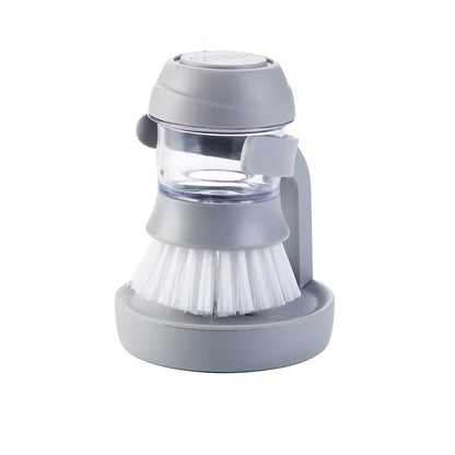 Grey multifunctional kitchen cleaning brush with automatic liquid adding and a scraper edge.