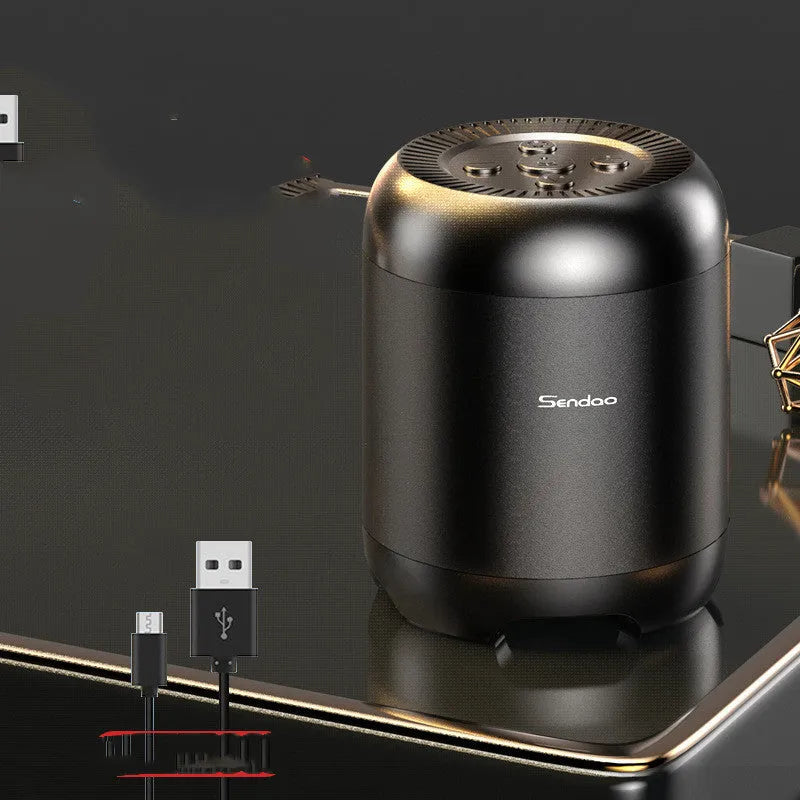 Small black or white wireless Bluetooth speaker with super subwoofer on a desk.