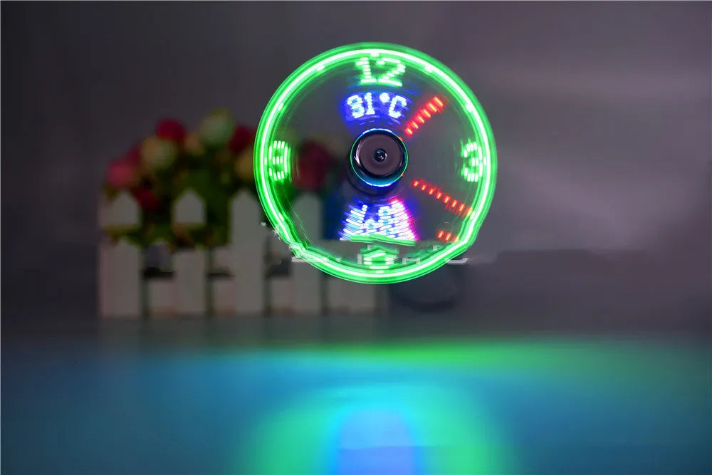 Silver USB desk fan with flexible metal neck and LED display showing time and temperature