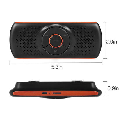 Orange plastic Bluetooth hands-free car speaker clipped to a car sun visor
