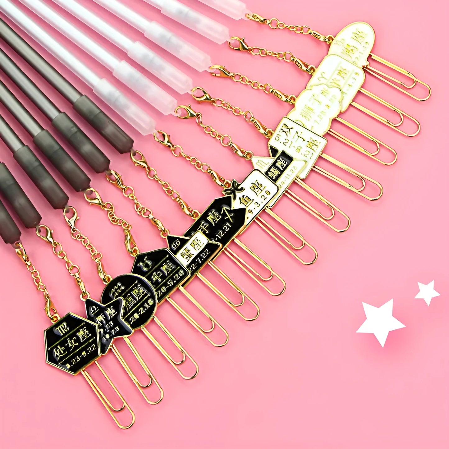 Twelve constellation-themed 0.5mm gel pens displayed with five design variants including pendant, bulb, and paper clip models