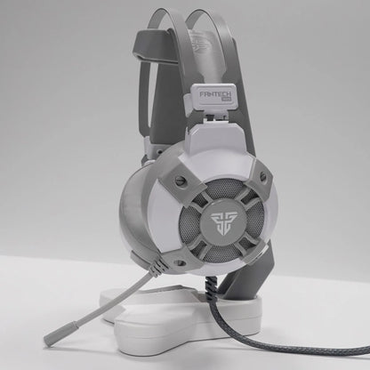 Black FANTECH HG11 USB gaming headset showing over-ear design, RGB lights on cups, and inline remote on cable.