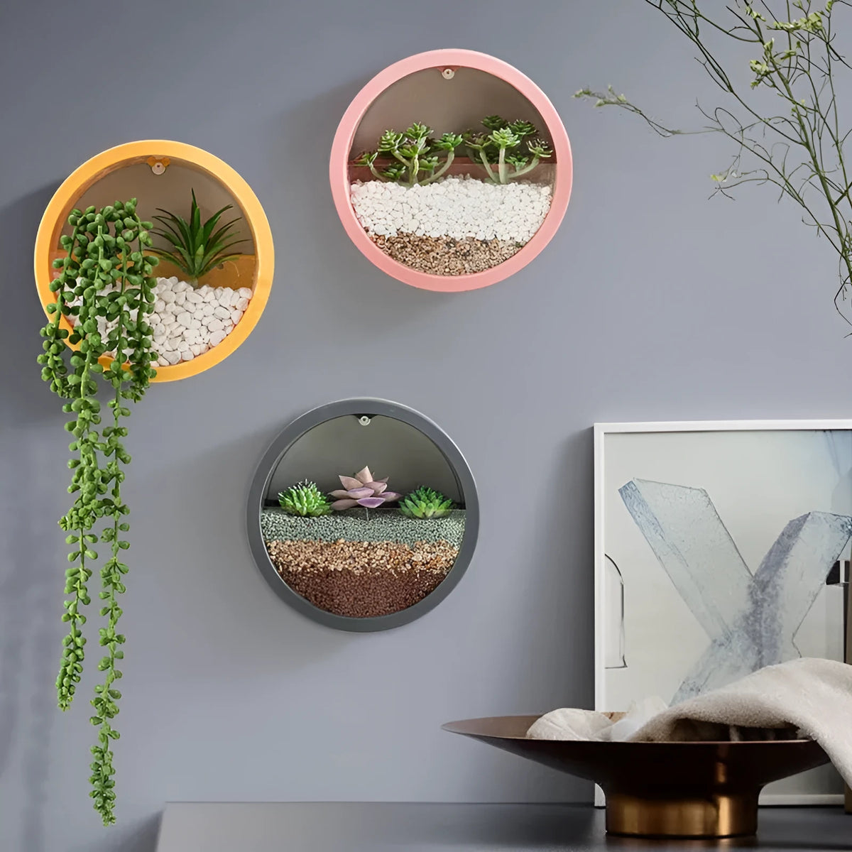Round iron style plastic wall vase hanging basket for flowers in multiple colour options.