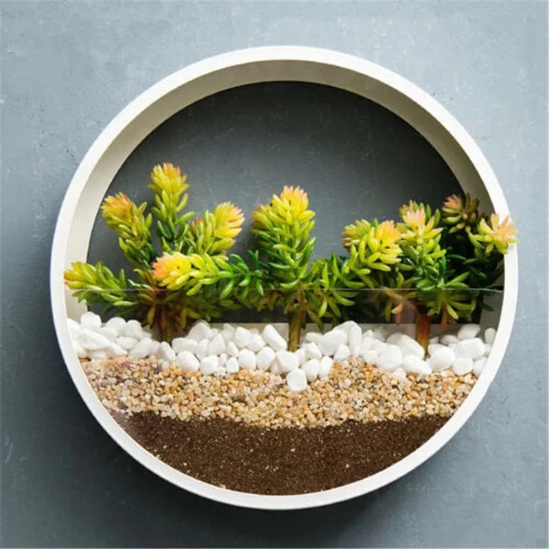 Round iron style plastic wall vase hanging basket for flowers in multiple colour options.
