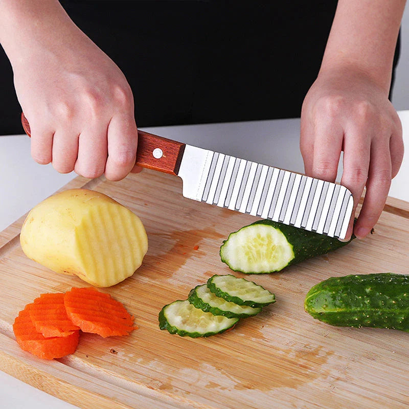 Stainless steel potato cutter with wave-style blade for creating professional-looking chips, vegetable slices, and fruit displays