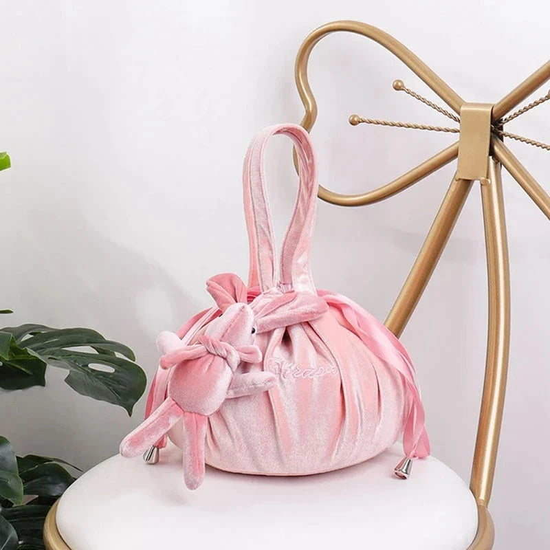 Adorable rabbit ear velvet cosmetic bags in various colors for storing and organizing makeup, toiletries, and other beauty essentials.