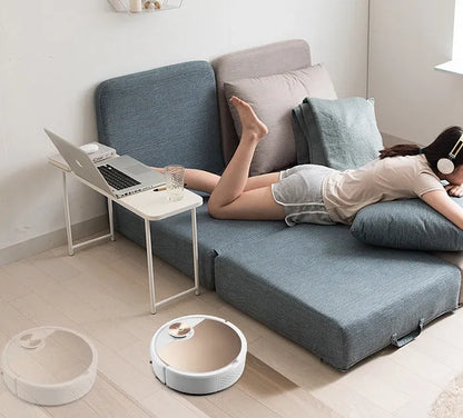 Golden intelligent sweeping robot vacuum cleaner with remote control on wooden floor