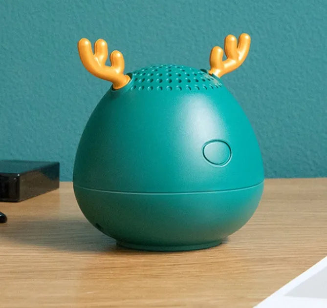 Compact portable Bluetooth speaker in white, pink or green with USB charging cable