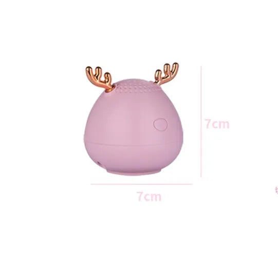 Portable Bluetooth speaker wireless small audio device with built-in 300mAh lithium battery, USB charging, 75x88mm compact size, and choice of white, pink or green colours for indoor and outdoor music playback