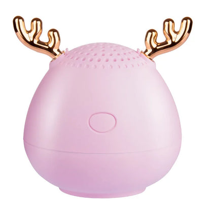 Compact portable Bluetooth speaker in white, pink or green with USB charging cable