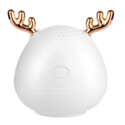 Compact portable Bluetooth speaker in white, pink or green with USB charging cable